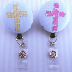 Cross badge reels