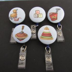 Vintage toy badge reel