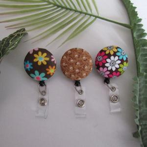 Brown floral badge reel to hold ID, nametag, or keys