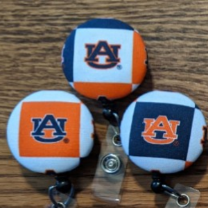 Illinois and Auburn badge reels