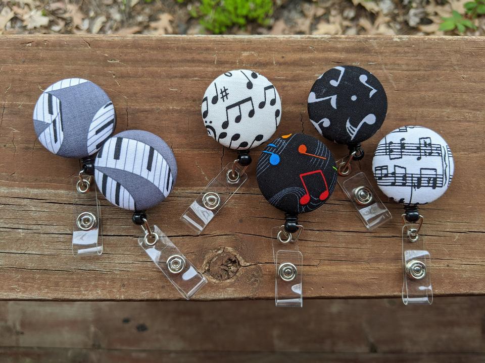 Decorative musical badge reel for teachers or others for ID tag.
