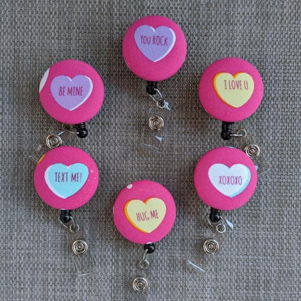 Conversation heart badge reels for work or school.