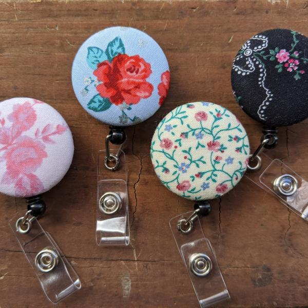 Floral design badge reel