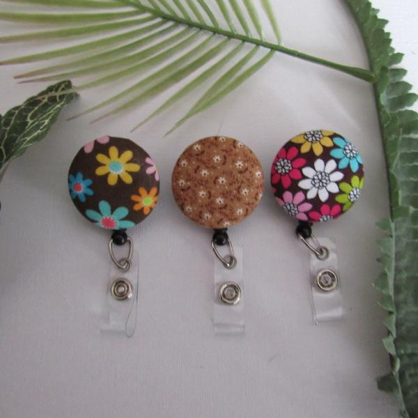 Brown floral badge reel to hold ID, nametag, or keys